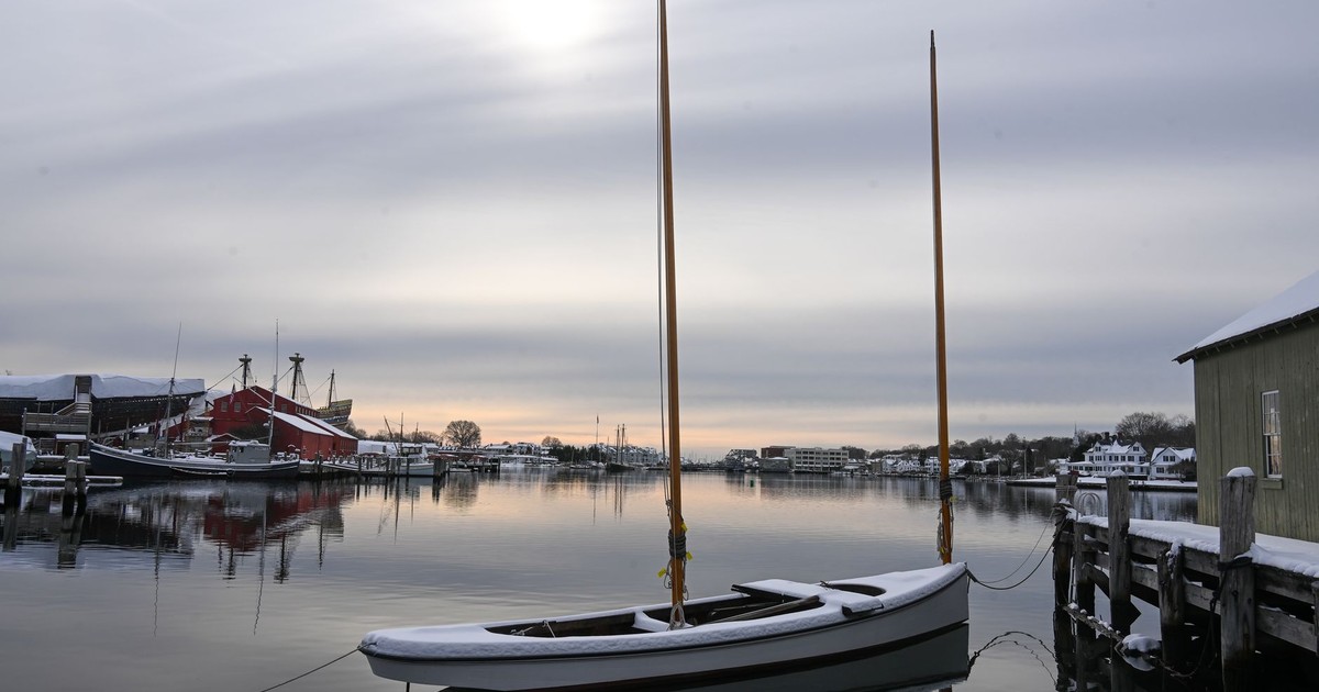 Serene winter view of boats and pier at Stonington Harbor, Connecticut.