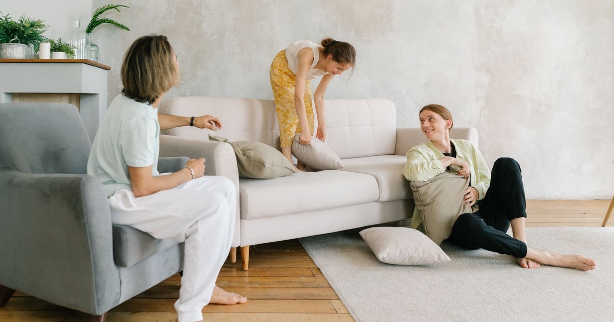 A family enjoying playful times in a chic living room, emphasizing warmth and connection.