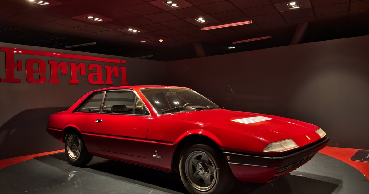 Classic red Ferrari showcased at an automotive museum in Turin, Italy. Iconic Italian design.