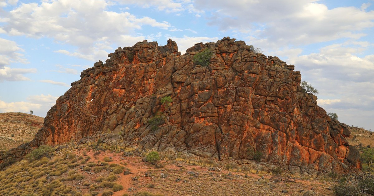 Explore the dramatic rock formations of Australia's Northern Territory under a vibrant sky.