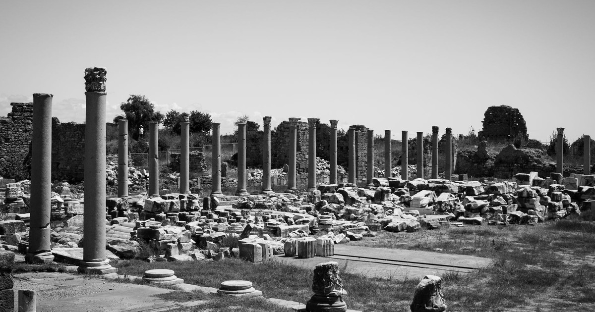 Ancient stone ruins with columns in Turkey, captured in black and white for a timeless feel.