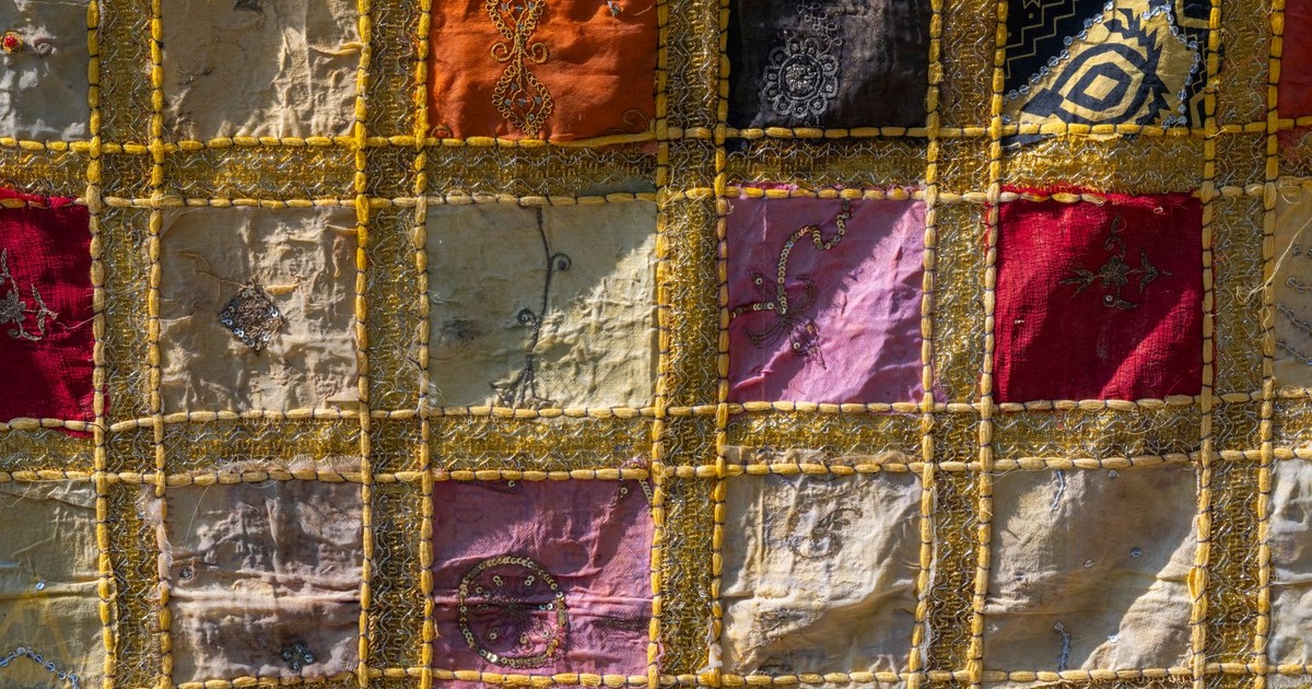 Colorful patchwork quilt featuring traditional designs and textures, perfect for home decor inspiration.
