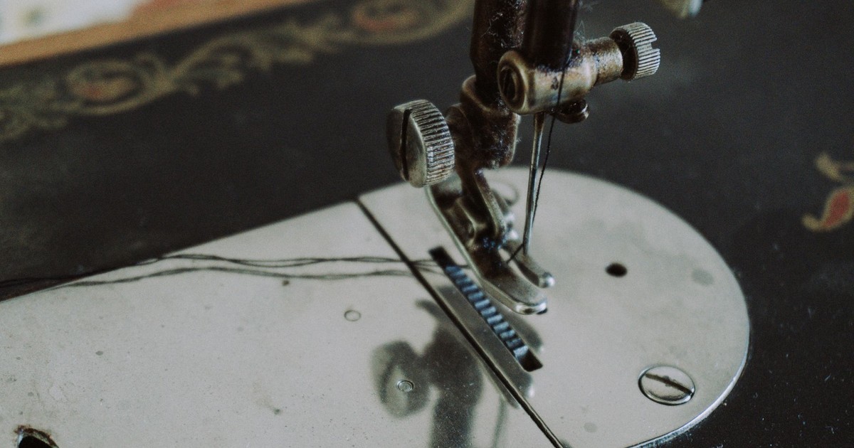 Close-up of an antique sewing machine in Oghuz, Azerbaijan, showcasing detailed craftsmanship.
