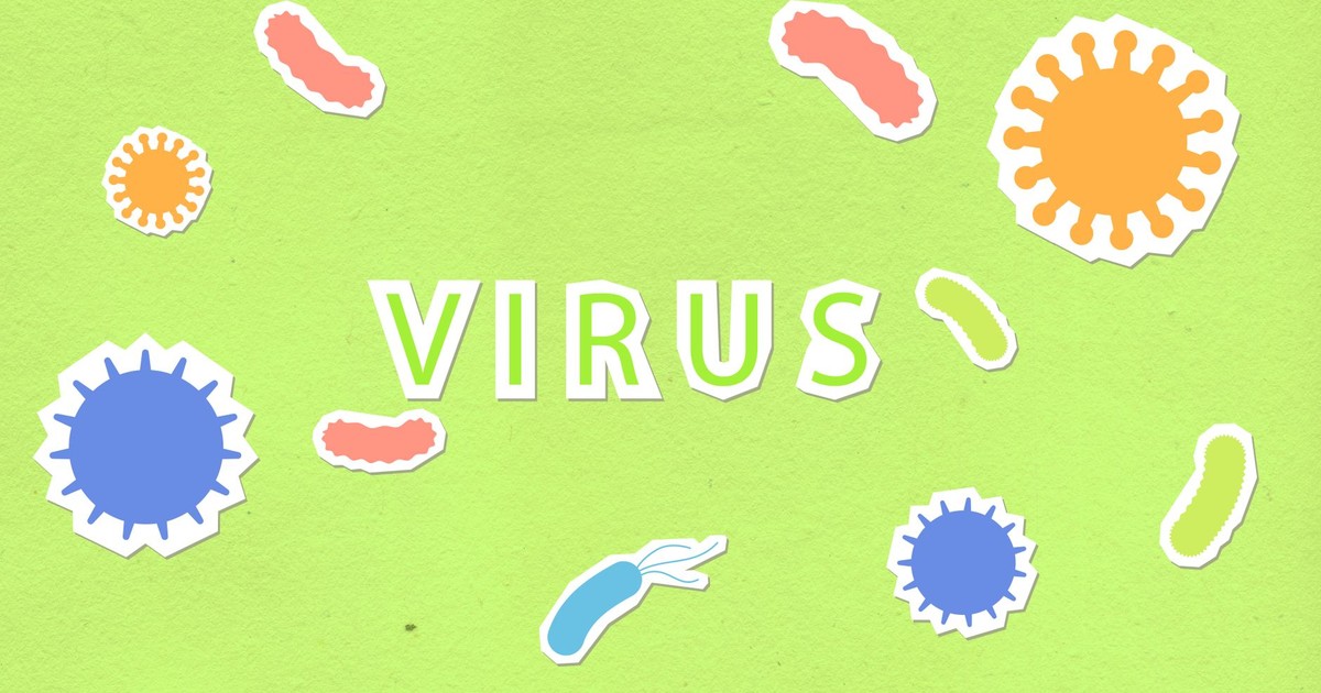 Paper cutout of Virus inscription on green background with abundance of different types of dangerous microorganisms during coronavirus disease pandemic