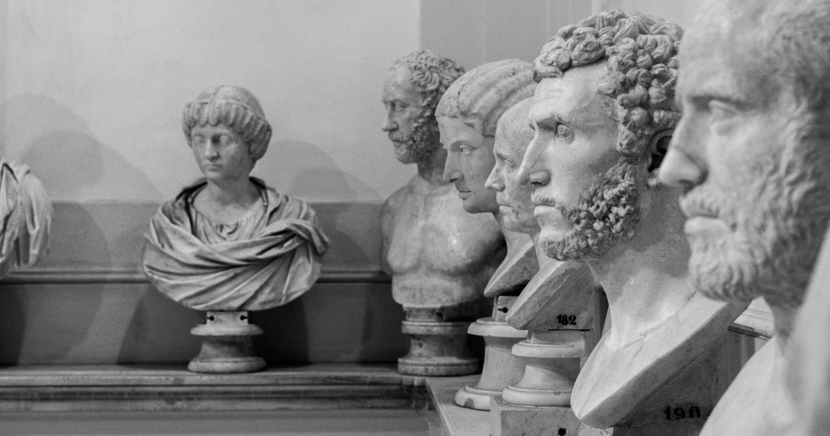 Collection of ancient Roman busts showcasing historic sculptures indoors.