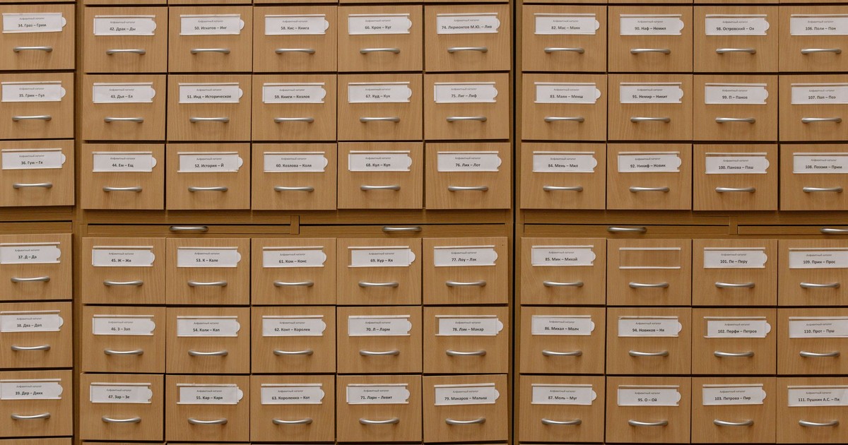 Close-up of labeled wooden storage drawers, perfect for organization concepts.