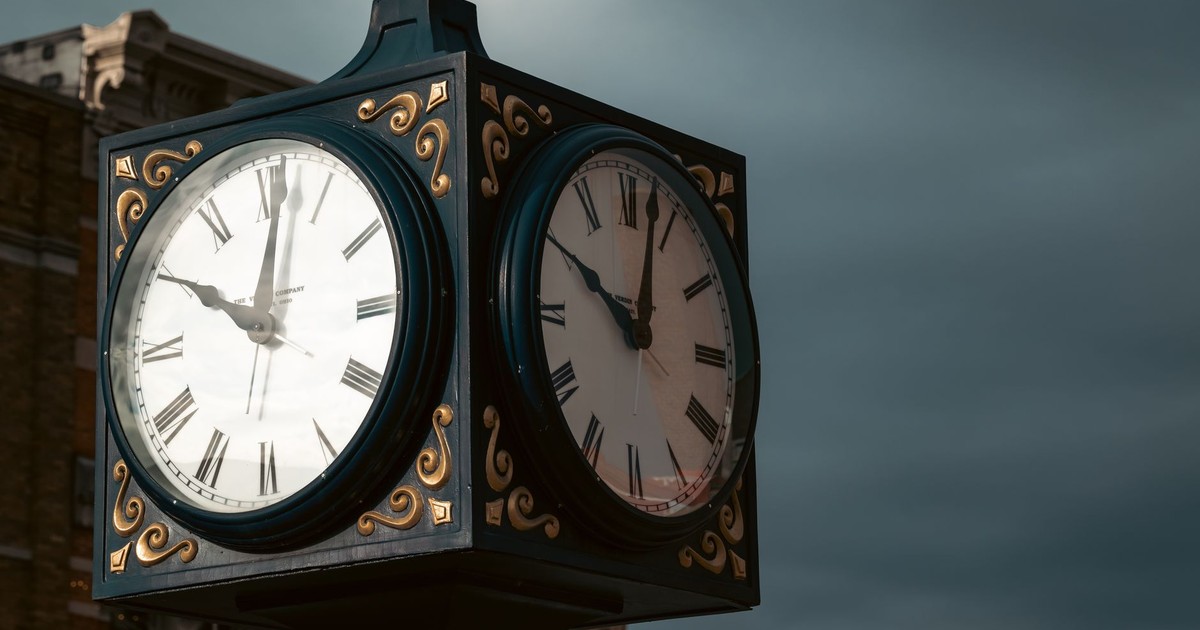 Elevate spaces with a classic outdoor clock displaying Roman numerals against a moody sky backdrop.