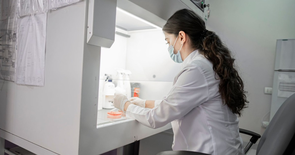 A female scientist wearing a mask works in a laboratory in Baku, Azerbaijan.