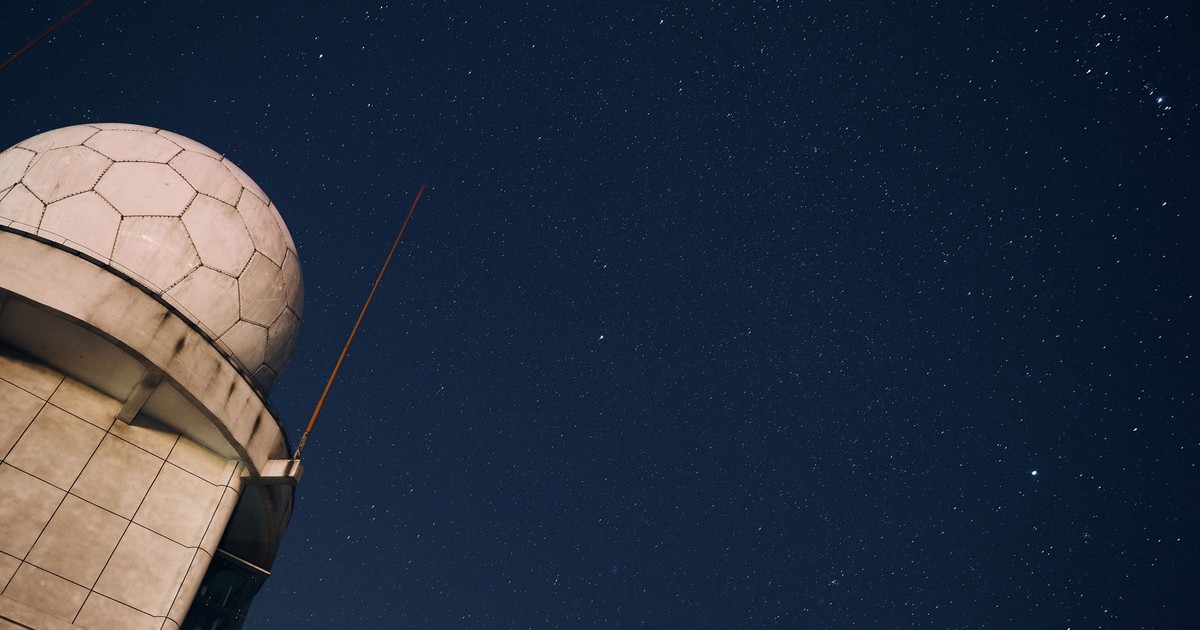 A stunning view of a starry night sky above an observatory dome, capturing the beauty of the cosmos.