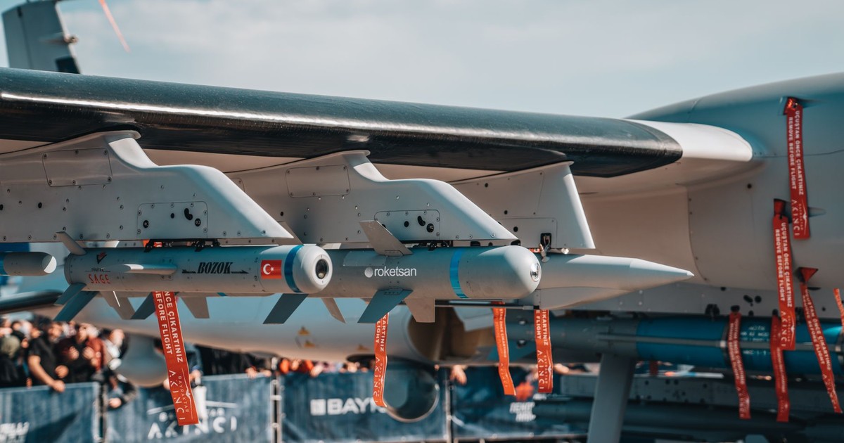 Detailed view of armaments on a Turkish military aircraft displayed at an air show.