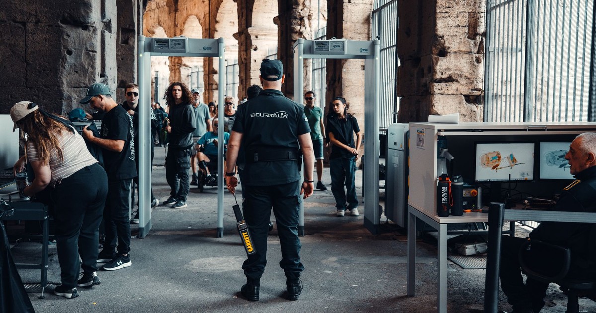 Security checkpoint with guards at a bustling historical site entrance.