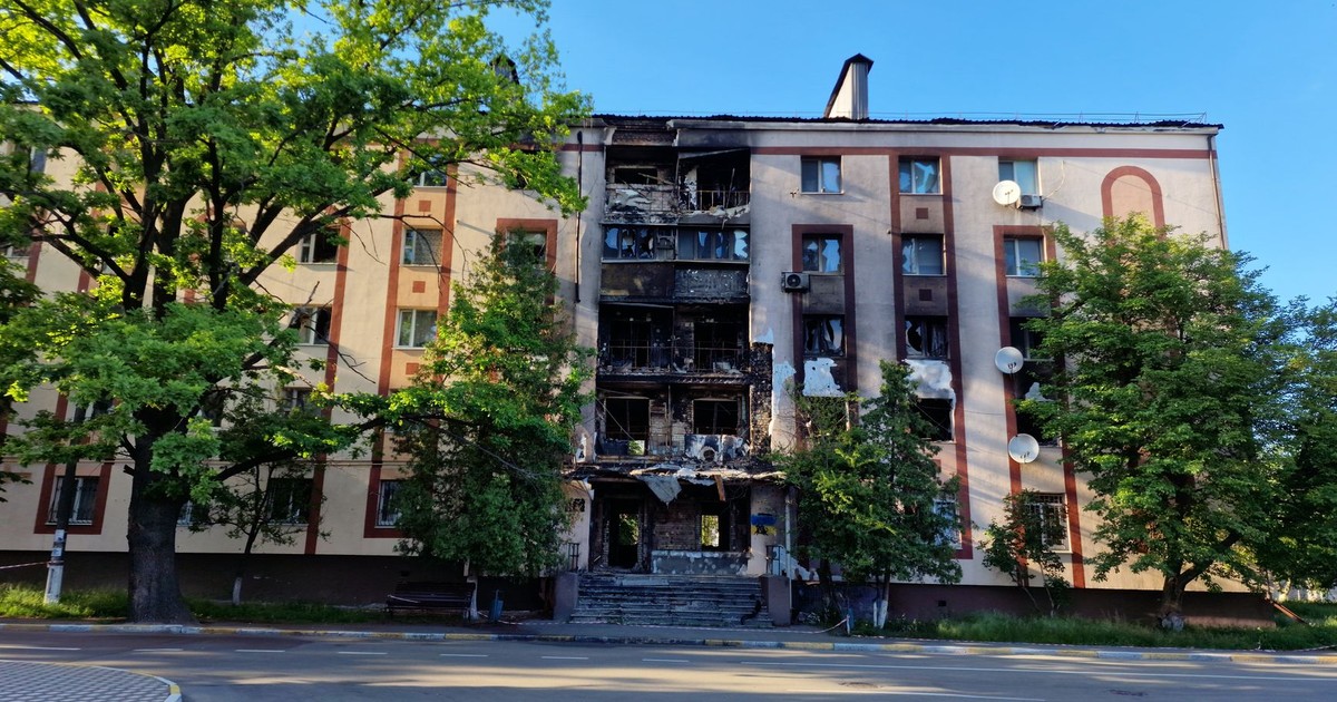 Burnt facade of an apartment building on a city street in Bucha, Ukraine.