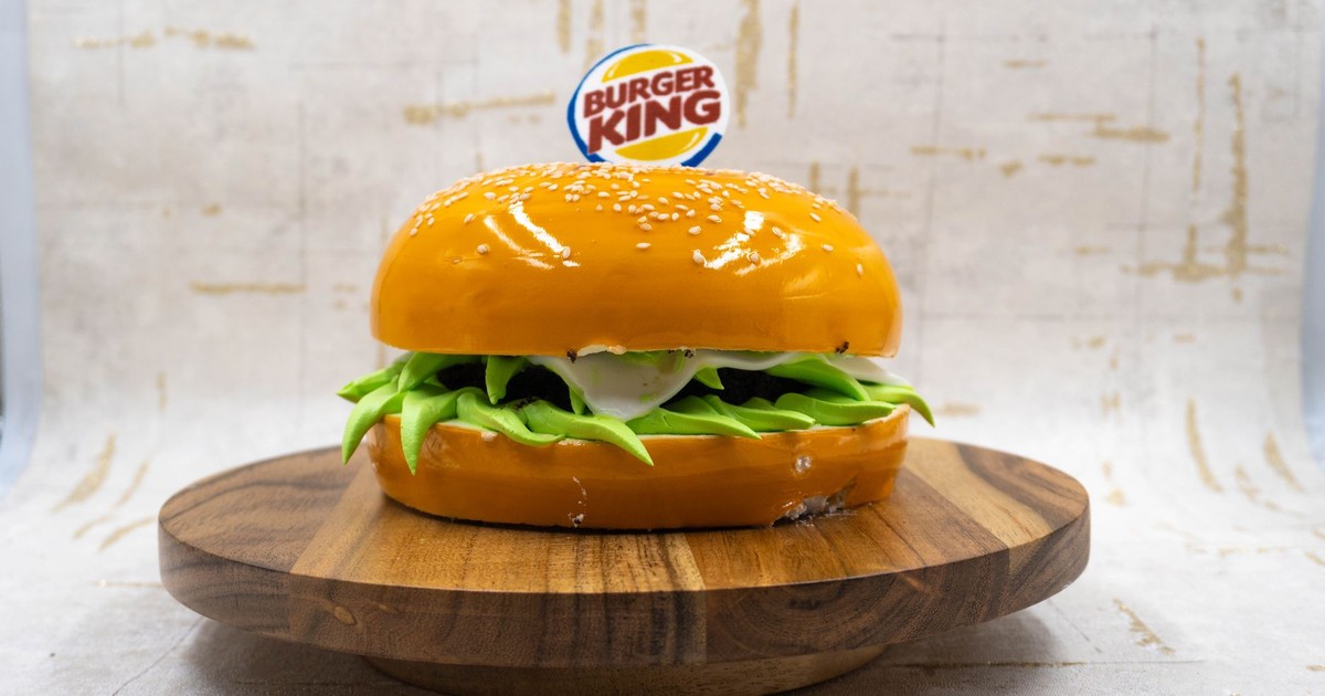 A hyper-realistic cake resembling a Burger King burger, showcasing creativity and artistry, perfect for novelty cake ideas.