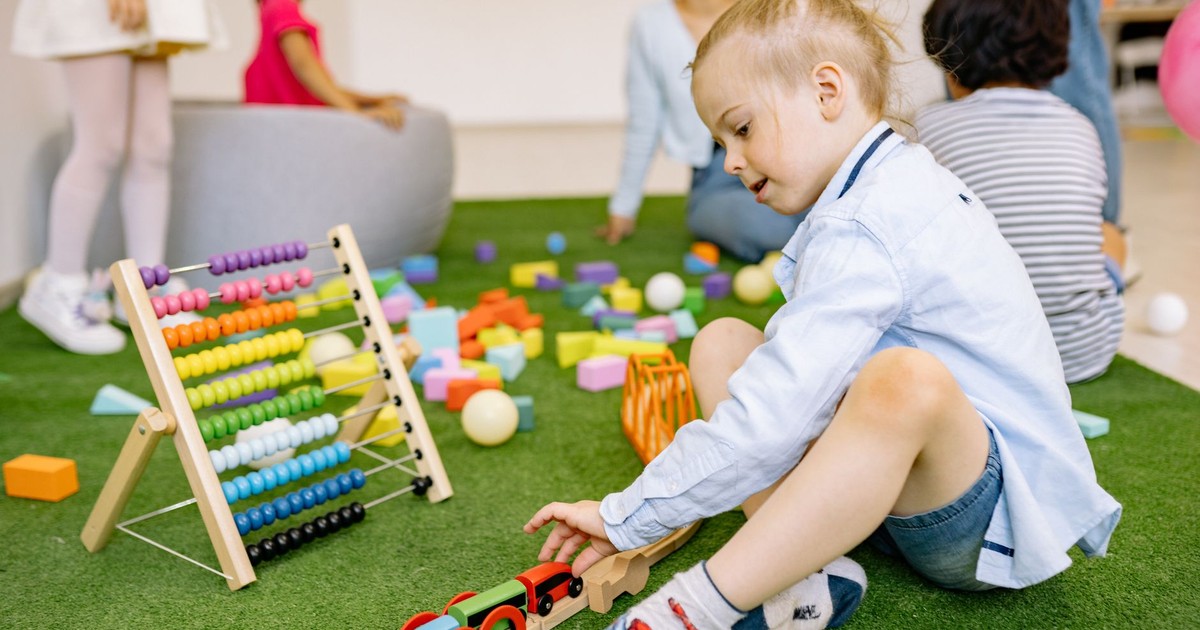 Kids enjoying playtime with toys and activities in a vibrant kindergarten setting.