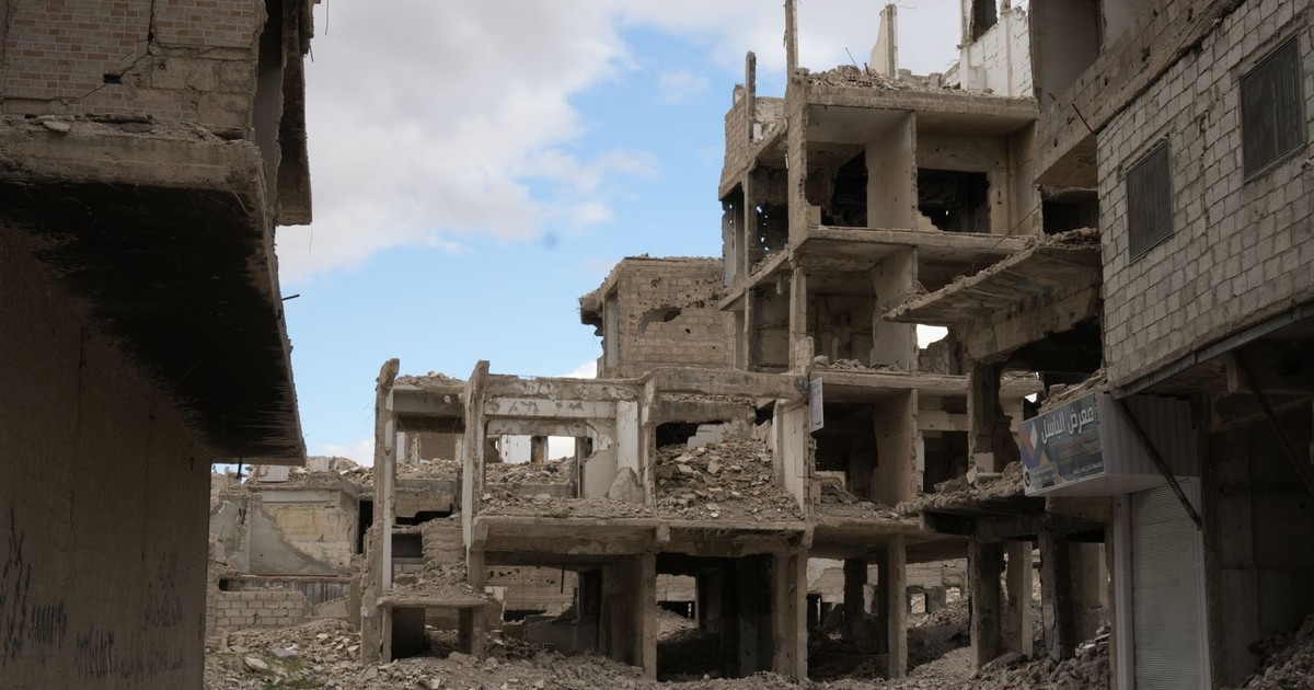 A haunting view of abandoned and destroyed buildings in Damascus, reflecting the impact of conflict.