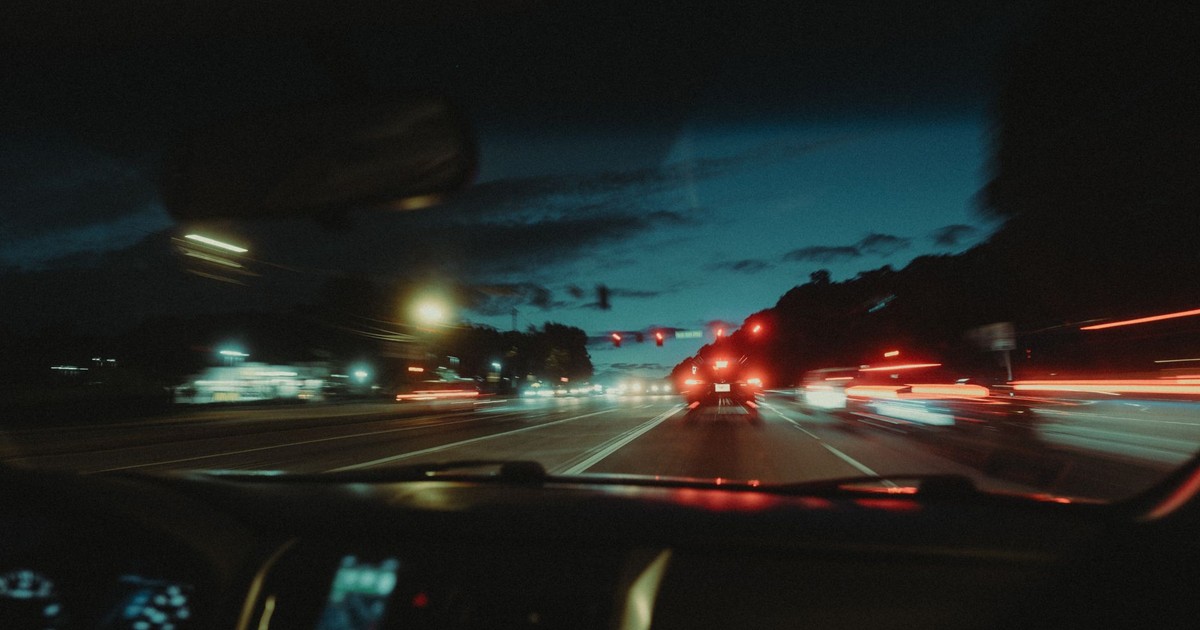 Experience a dynamic night drive through Atlanta with vibrant light trails and city ambiance.