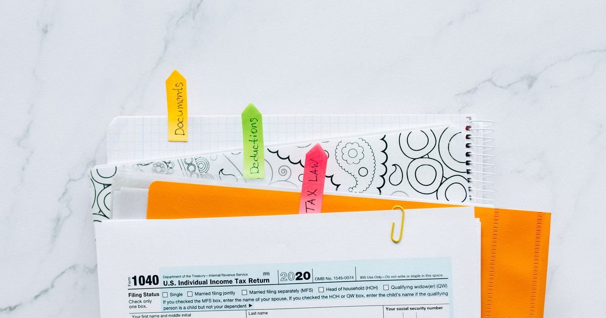 Colorful tabs organizing tax documents for easy filing and reference.