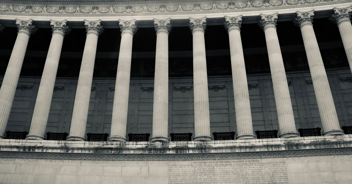 Detailed view of neoclassical columns in a government building facade.