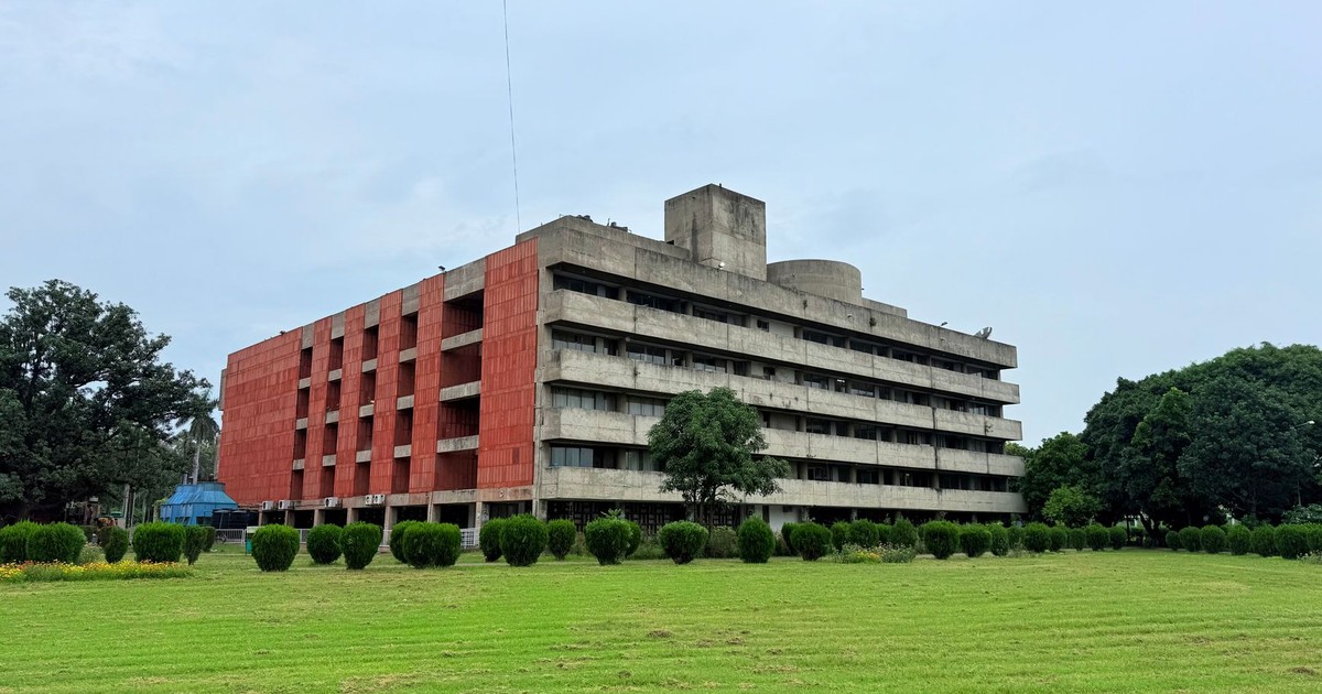 Concrete BR Ambedkar Administrative Building nestled in green garden, Chandigarh.