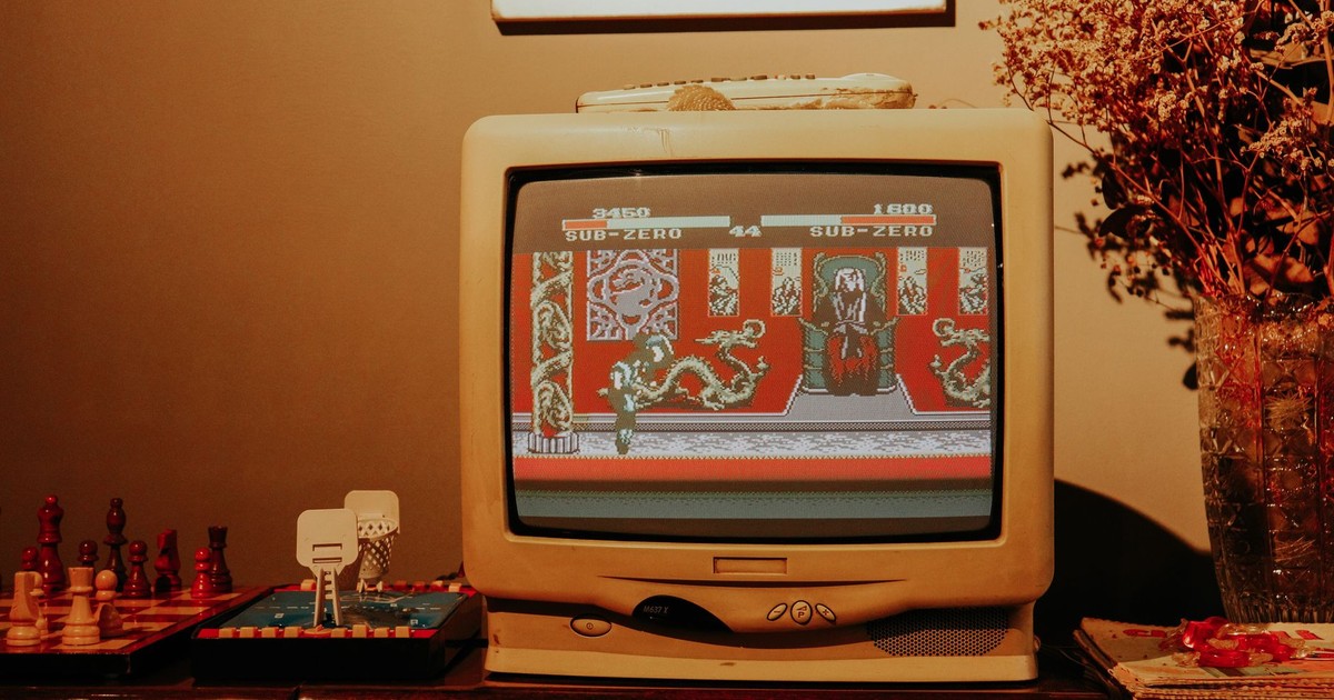 Retro living room scene featuring vintage TV playing classic video game.