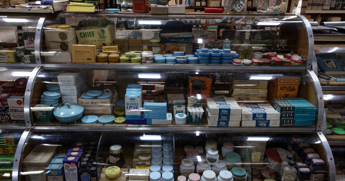 A nostalgic display of vintage products inside a retro-style store, showcasing old-fashioned packaging and design.