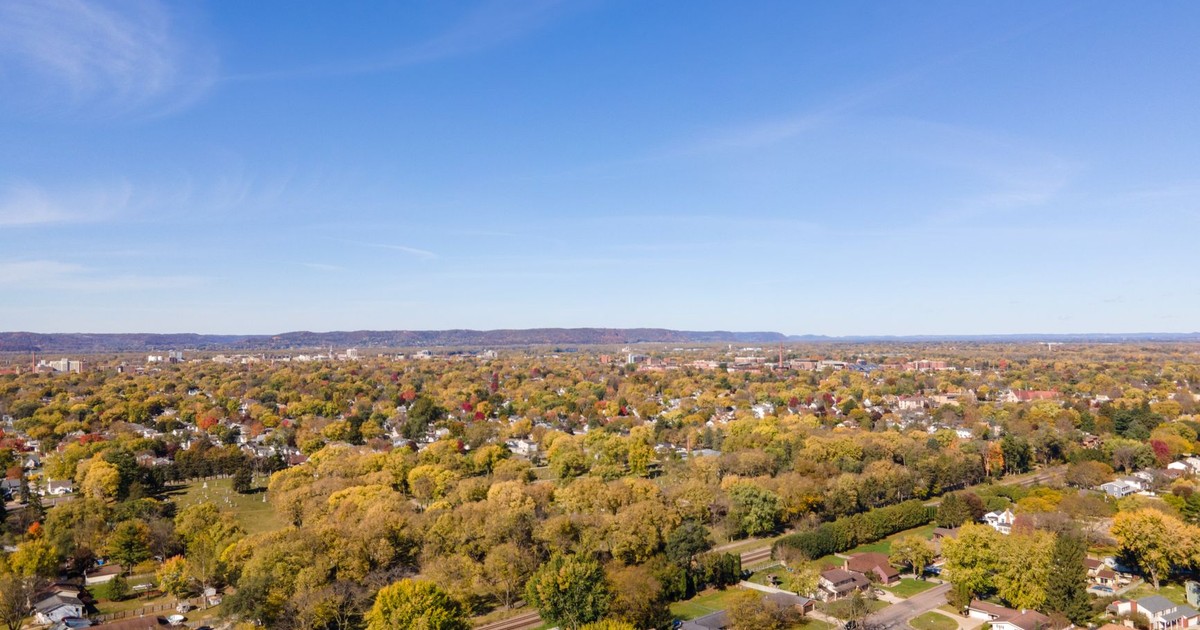 A vibrant aerial image showcasing residential areas and fall foliage in La Crosse, Wisconsin.
