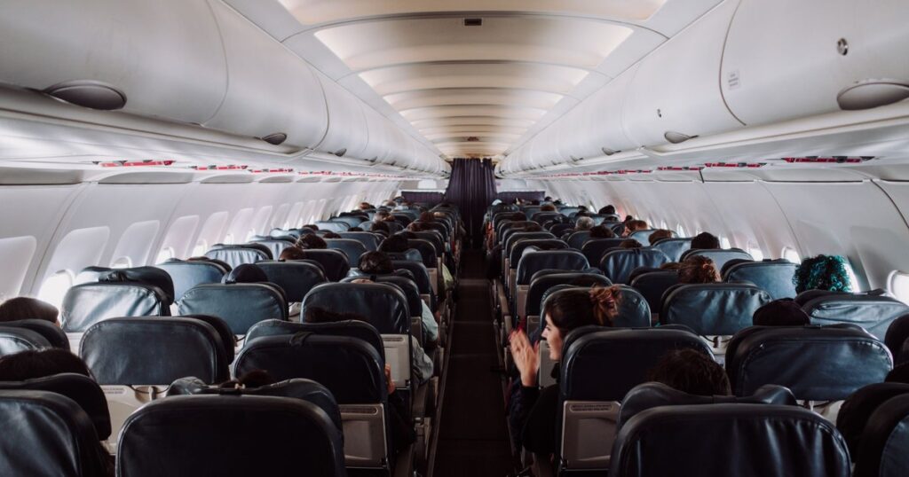 The Hidden Button on Your Airplane Aisle Seat Armrest You Never Knew About - Featured image