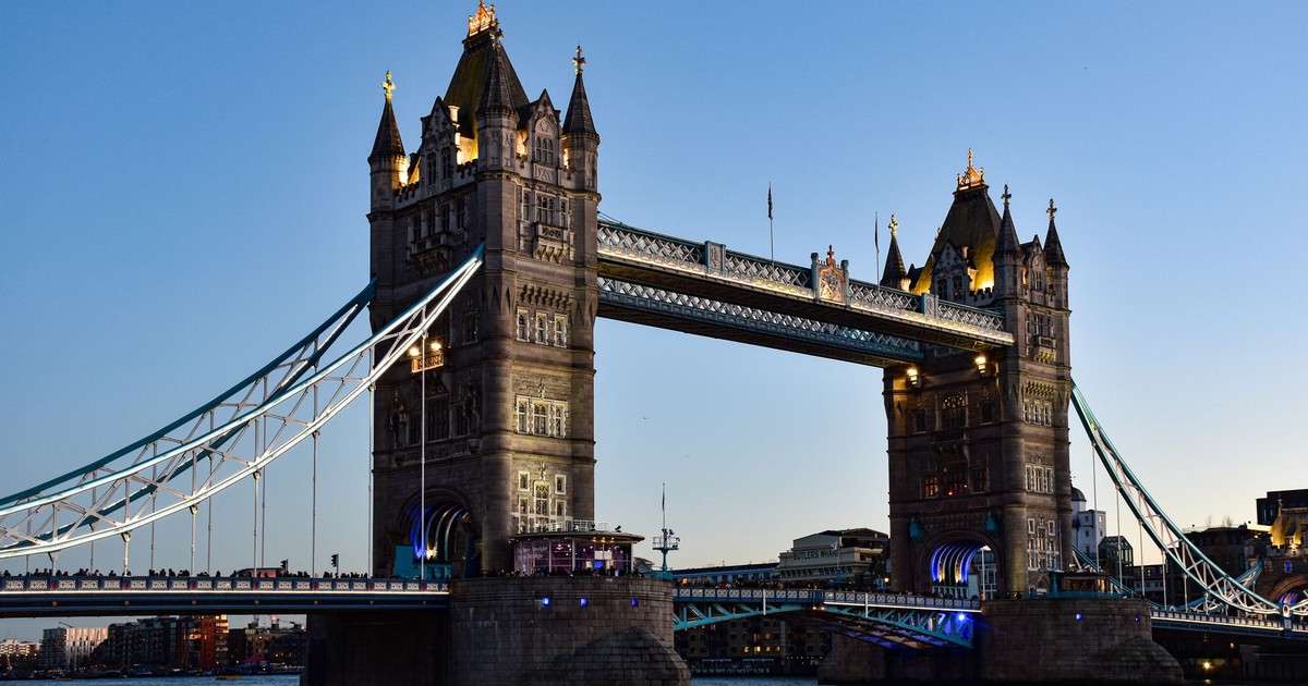 Tower Bridge elegantly lit against the evening sky in London, UK.