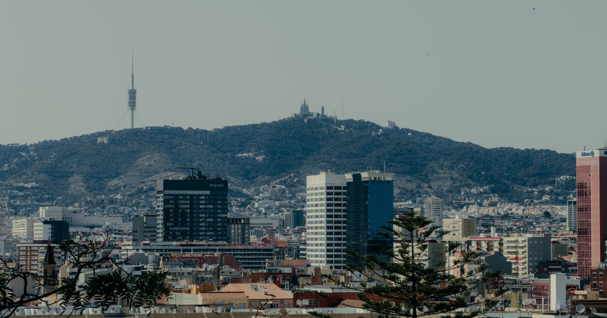 Scenic view of Barcelona skyline featuring Tibidabo Mountain and Collserola Tower.