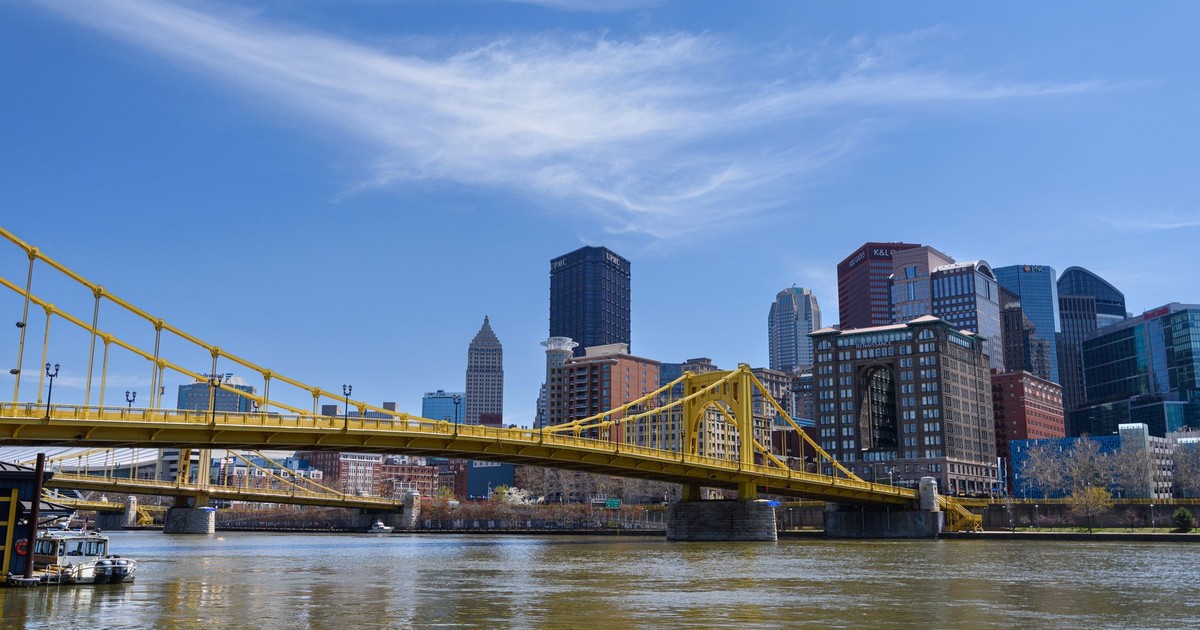 Scenic view of the Pittsburgh skyline featuring the yellow bridge on a clear day.