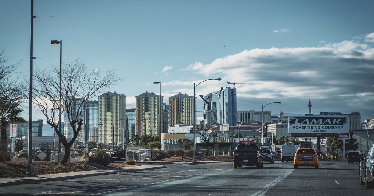 Dynamic view of Las Vegas skyline with bustling street traffic and modern skyscrapers.
