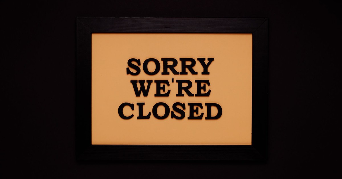 Black-framed 'Sorry We're Closed' sign against a dark backdrop, ideal for business themes.