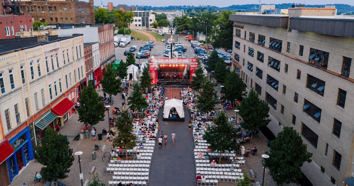 Aerial view of an outdoor concert in Chattanooga, capturing vibrant city vibes and a lively gathering.