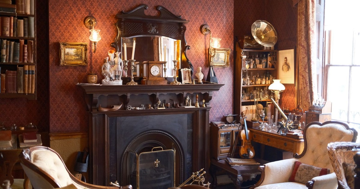 Cozy Victorian-style living room with antique fireplace and decor.