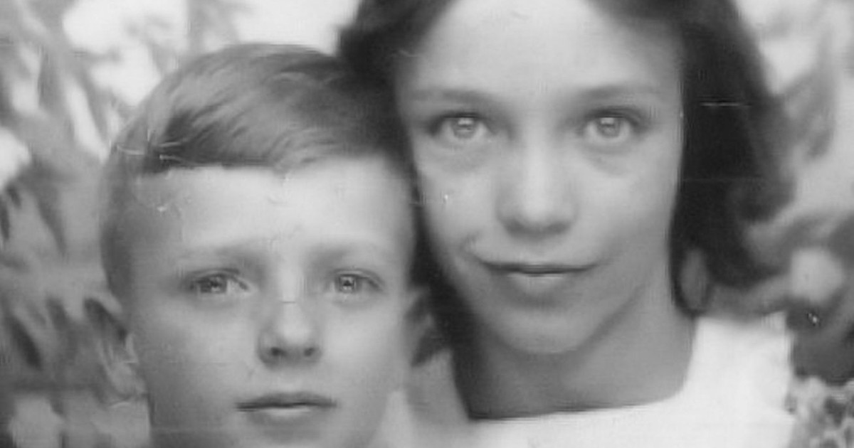 Vintage black and white portrait of siblings in a close pose.
