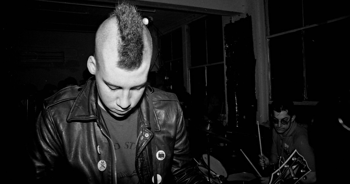 Moody monochrome image of a punk band capturing the energy of live music.