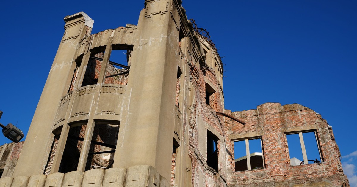 The Hiroshima Atomic Bomb Dome against a clear blue sky, symbolizing peace and history.