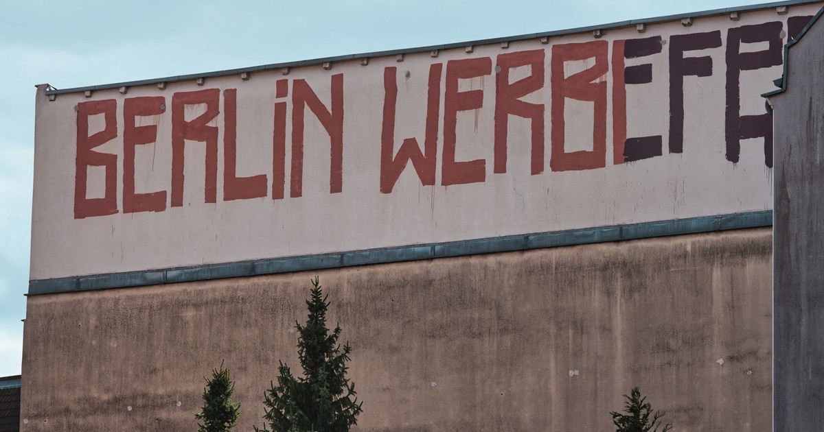 Graffiti on a building wall in Berlin, Germany, showcasing urban street art.