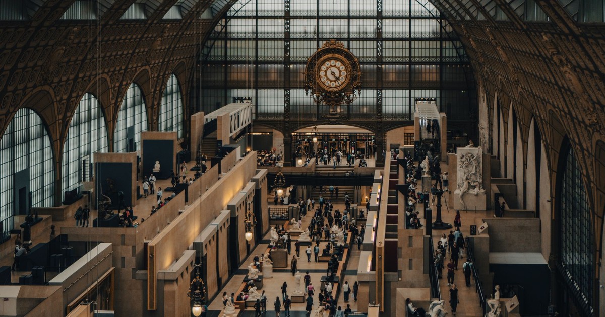 A bustling interior of the iconic Musée d'Orsay in Paris, France.