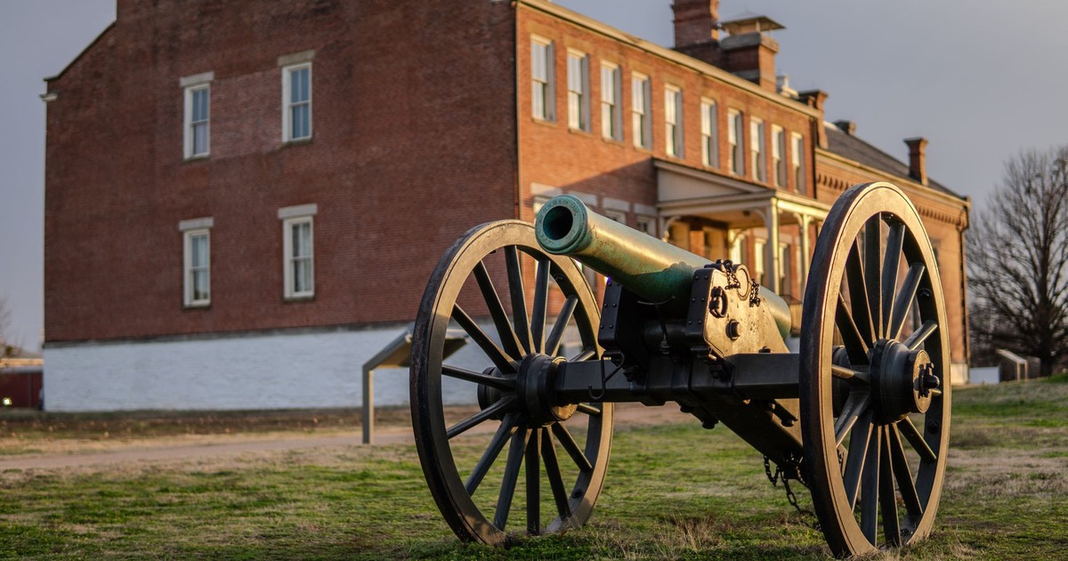 Cannon in front of a historic building at Fort Smith National Historic Site in Arkansas.