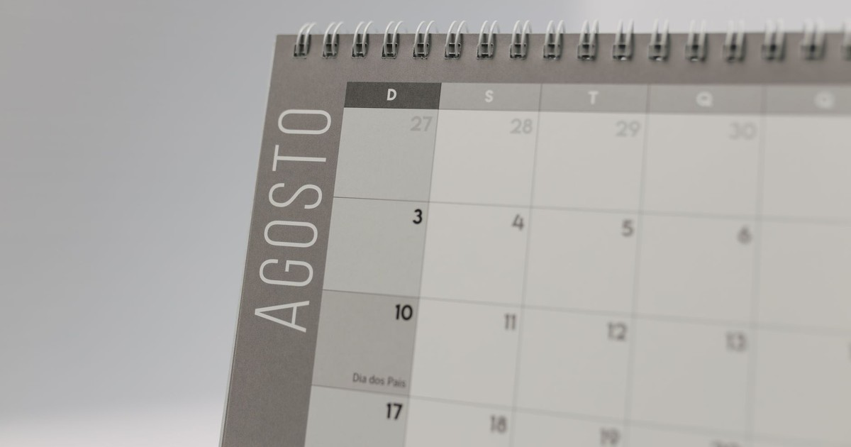 Close-up of a spiral-bound calendar highlighting August dates.