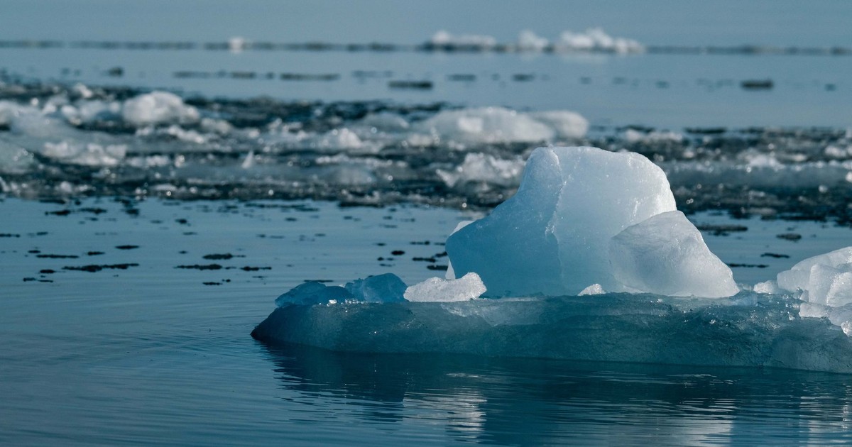 A tranquil scene of an iceberg in the vast Arctic Ocean, evoking peace and solitude.