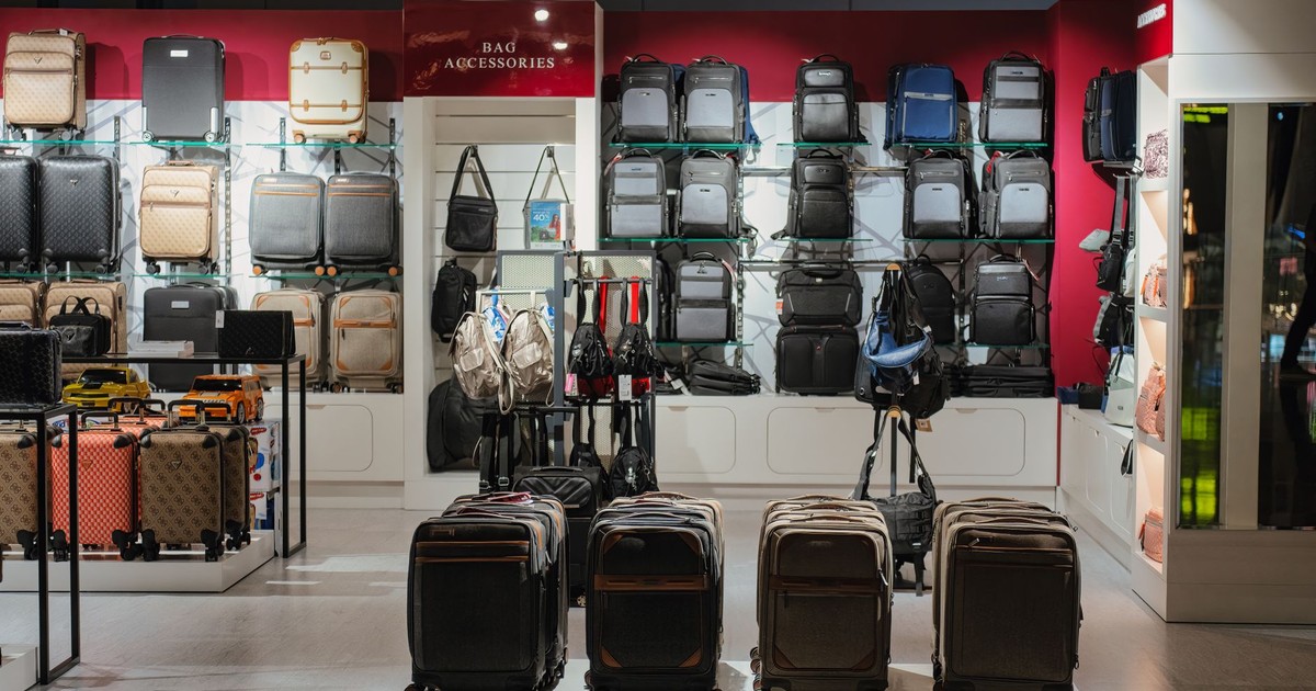 Elegant luggage display in a premium Doha airport shop, Qatar.