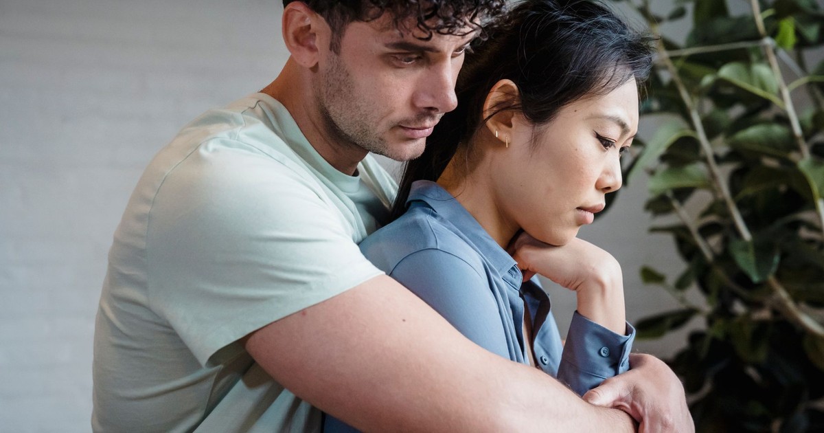 A close-up of a loving couple embracing, symbolizing intimacy and connection.