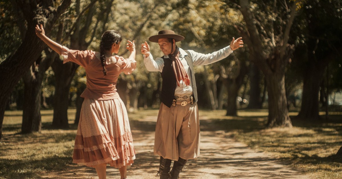 A couple dressed in traditional clothing performs a dance in Chascomús, Argentina.