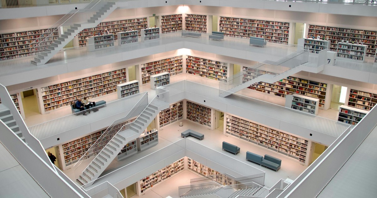 Spacious multi-story library interior in Stuttgart showcasing modern architecture and design.