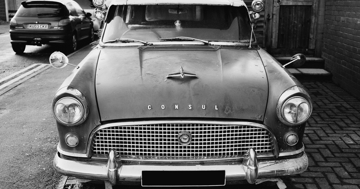 Vintage Ford Consul parked on a street, captured in monochrome for a timeless effect.