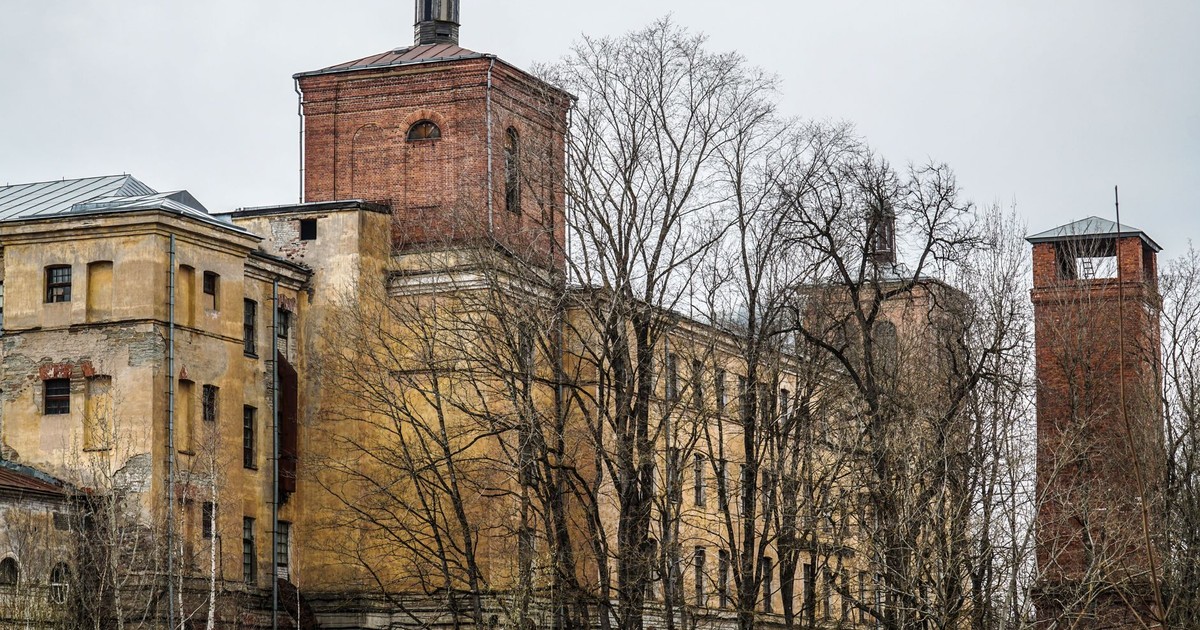 Old and neglected industrial building with barbed wire in Narva, Estonia.
